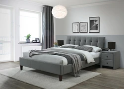 Bedroom design with light gray bed
