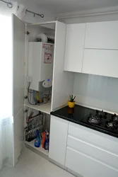 Kitchen Interior With Gas Boiler On The Floor