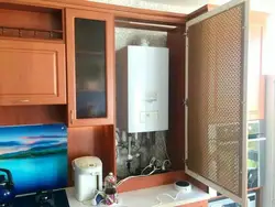 Kitchen interior with gas boiler on the floor