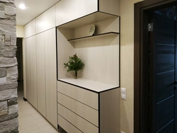 Photo of a hallway in a modern style up to the ceiling
