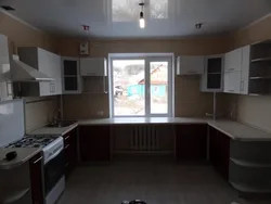 U-shaped kitchen design with a window in the middle