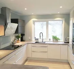 U-shaped kitchen design with a window in the middle