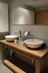Washbasin on the countertop in the bath photo