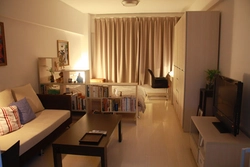 Design of a living room and a children's room in one room 20 sq m