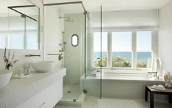 Bathtub combined with toilet with window photo