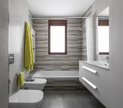 Bathtub Combined With Toilet With Window Photo