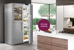 Built-in refrigerator in the kitchen interior photo