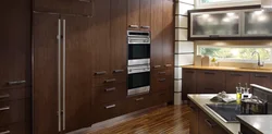 Built-in refrigerator in the kitchen interior photo