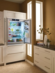 Built-in refrigerator in the kitchen interior photo