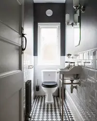 Interior Of A Toilet With A Sink Without A Bathtub