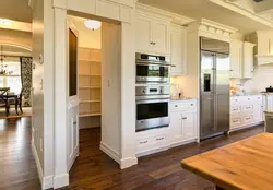 Photo of a kitchen with a large refrigerator photo