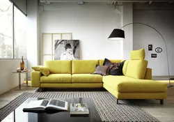 Photo of a living room with a mustard-colored sofa