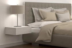 Photo of hanging bedside tables in the bedroom