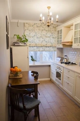 Design of a small kitchen with a window in an apartment