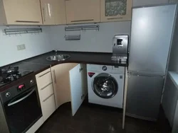 Corner kitchen design with refrigerator and washing machine photo