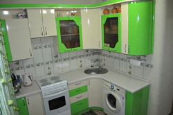 Corner kitchen design with refrigerator and washing machine photo