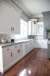 White kitchen design with gray countertop photo