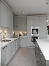White Kitchen Design With Gray Countertop Photo