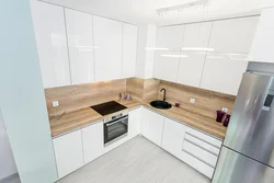 Corner kitchen with wooden countertop photo