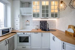 Corner kitchen with wooden countertop photo
