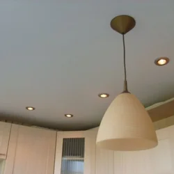 Design of a matte stretch ceiling in the kitchen photo