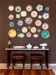 Decorative plates on the wall in the kitchen interior