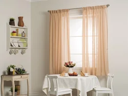 Beige wallpaper in the living room interior, which curtains are suitable