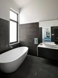 Bathtub with gray floor photo