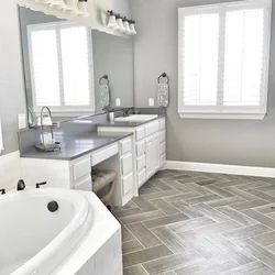 Bathtub with gray floor photo