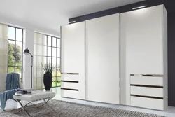 Wardrobe with mirror in the living room interior