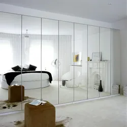 Wardrobe with mirror in the living room interior
