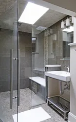 Bathroom interior with shower screen and washing machine