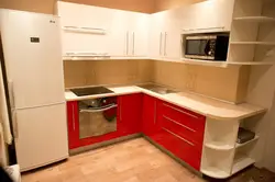 Bright Corner Kitchen With Refrigerator Photo