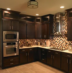 Bright corner kitchen with refrigerator photo