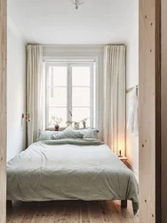 Double Bed By The Window In A Small Bedroom Photo