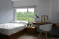 Double bed by the window in a small bedroom photo
