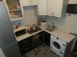 Layout In A Small Kitchen With A Refrigerator And Washing Machine Photo