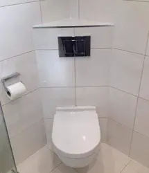 Toilet in the bathroom in the corner photo