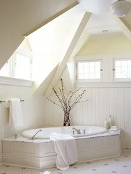 Bathroom design in the attic with a sloping ceiling