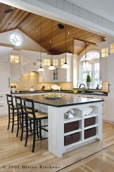 Kitchen with island in a country house design photo