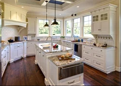 Kitchen with island in a country house design photo