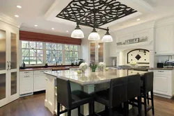 Kitchen with island in a country house design photo