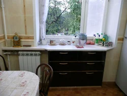 Cabinet In The Window Sill In The Kitchen Photo