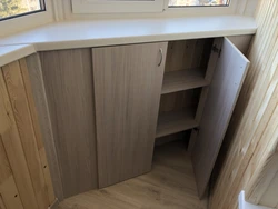 Cabinet in the window sill in the kitchen photo