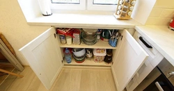 Cabinet In The Window Sill In The Kitchen Photo