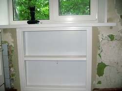 Cabinet in the window sill in the kitchen photo