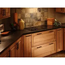 Photo Of A Kitchen With An Apron And A Wood-Look Countertop