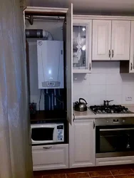 Kitchen Design With A Column And A Refrigerator By The Window