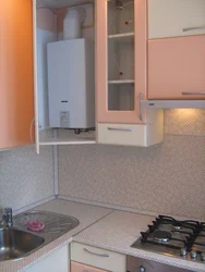 Kitchen Design With A Column And A Refrigerator By The Window