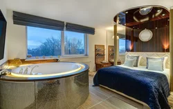 Photo of a bathtub with a jacuzzi in an apartment